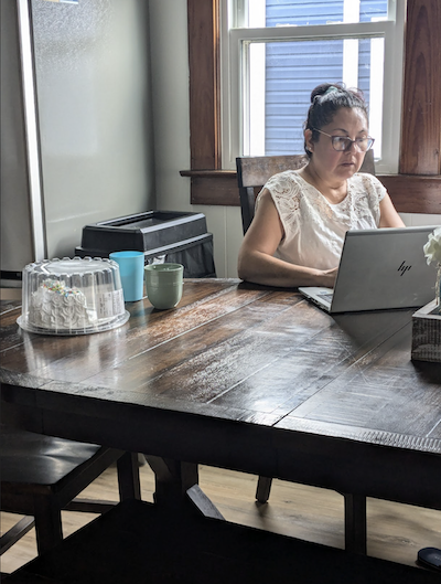 Woman working on computer at table